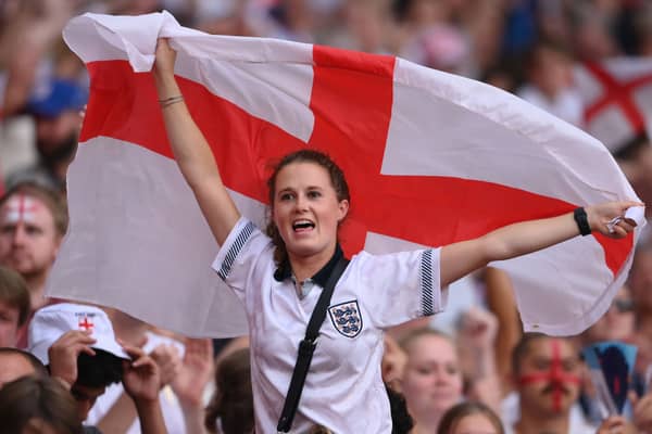 An England fan celebrates during the Lionesses 2-1 win over Germany in the Euro 2022 final. Credit: Mike Hewitt/Getty Images