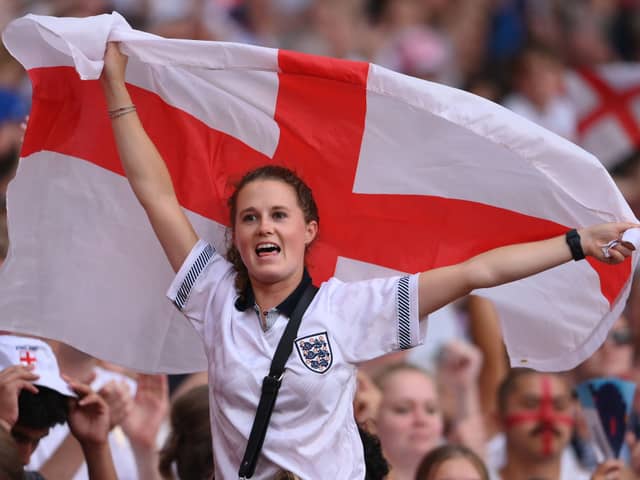 An England fan celebrates during the Lionesses 2-1 win over Germany in the Euro 2022 final. Credit: Mike Hewitt/Getty Images
