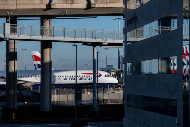 Planes of British Airways behind a hotel at Heathrow Airport. Photo: Chris J Ratcliffe/Getty Images