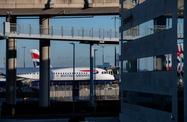Planes of British Airways behind a hotel at Heathrow Airport. Photo: Chris J Ratcliffe/Getty Images