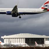 A British Airways plane flying over London Heathrow Airport. Photo: AFP via Getty Images