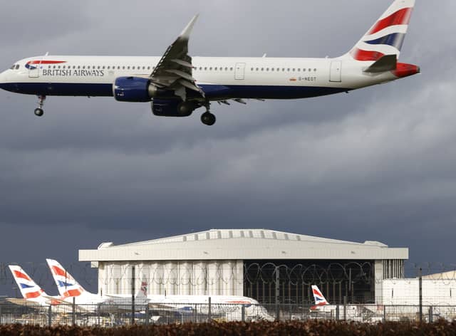 A British Airways plane flying over London Heathrow Airport. Photo: AFP via Getty Images