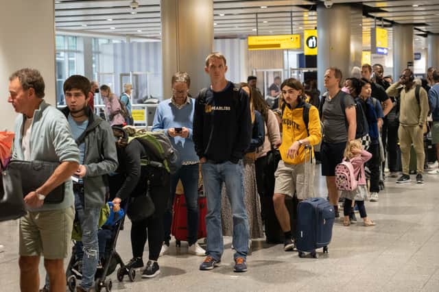 Travellers wait in a long queue to pass through the security check at Heathrow. Photo: Carl Court/Getty Images