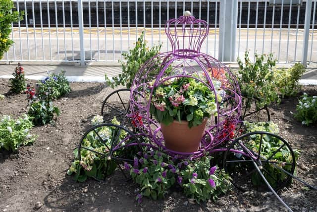 A carriage themed display in the Seven Kings station platform garden. Photo: TfL