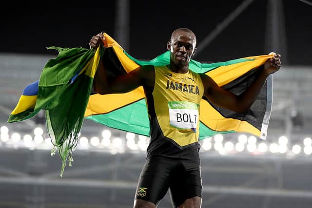 Usain Bolt of Jamaica celebrates winning the Men's 200m Final on Day 13 of the Rio 2016 Olympic Games at the Olympic Stadium on August 18, 2016