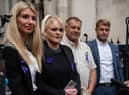 UNE 29: Hollie Dance (C-L) and Paul Battersbee (C-R), the mother and father of Archie Battersbee, speak to the media as they leave the Royal Courts of Justice after winning an appeal for his case to be heard again, on June 29, 2022 in London, England. The Court of Appeal has heard a plea by the family of 12-year-old Archie Battersbee to overturn a previous court ruling that he is dead and his life support system should be removed. His parents Hollie Dance and Paul Battersbee have appealed the ruling, saying his heart is still beating and they want treatment to continue. (Photo by Carl Court/Getty Images)