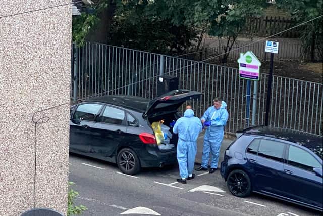 Forensic officers outside the house in Croydon on Monday morning as part of the search for Owami Davies. Credit: Iman Salah