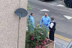 Police outside the house in Derby Road, Croydon, during a dawn raid in the search for missing student nurse Owami Davies. Credit: Iman Salah