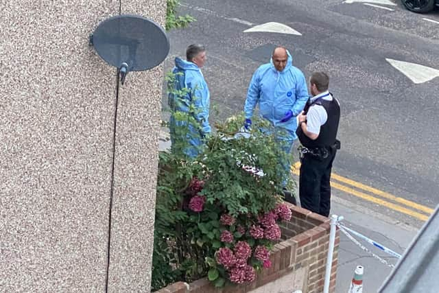 Police outside the house in Derby Road, Croydon, during a dawn raid in the search for missing student nurse Owami Davies. Credit: Iman Salah