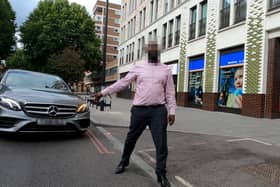 GoPro footage of close call with cyclist and driver in central London. Credit: SWNS