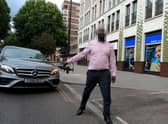 GoPro footage of close call with cyclist and driver in central London. Credit: SWNS