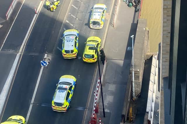 Armed police and paramedics in Creek Road, Greenwich, after police shot a man who was reportedly brandishing a gun. Credit: Gemma Rose