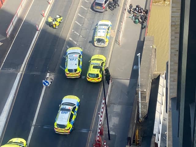 Armed police and paramedics in Creek Road, Greenwich, after police shot a man who was reportedly brandishing a gun. Credit: Gemma Rose