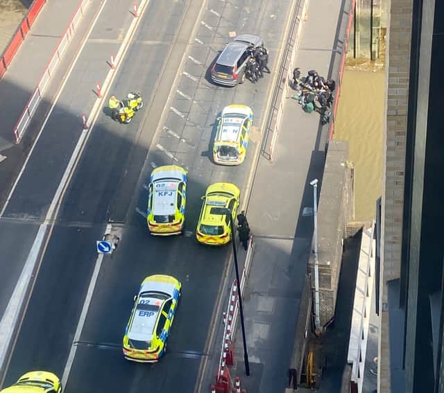Armed police and paramedics in Creek Road, Greenwich, after police shot a man who was reportedly brandishing a gun. Credit: Gemma Rose