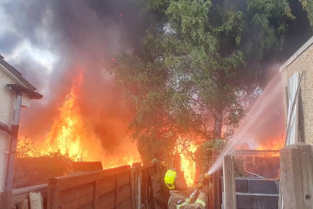 Firefighters battled to save 30 homes from an inferno sweeping across a row of gardens in Feltham, west London. Photo: LFB