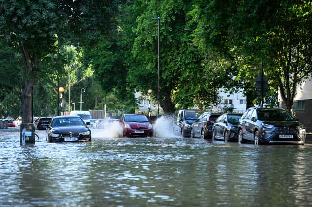 A car negotiates the substantial flooding on roads near to the Arsenal Stadium, following a rupture of water mains. Photo: Getty