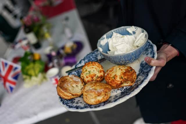 Scones and cream is served at the Melbourne Street Party celebrating the Queens' Platinum Jubilee on June 05, 2022