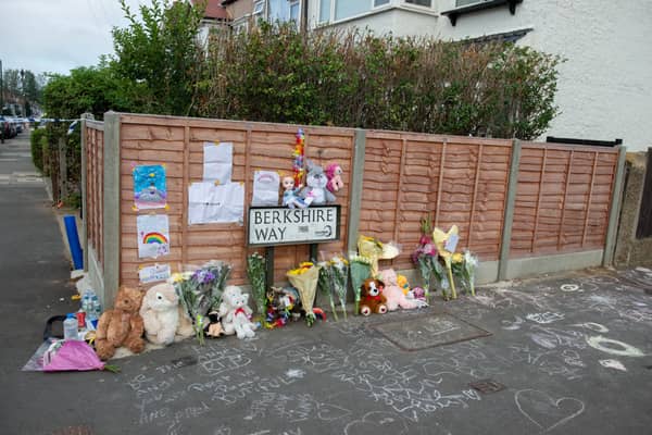 Flowers and tributes at street where a suspected gas explosion demolished a home yesterday killing a four-year-old girl. Credit: SWNS