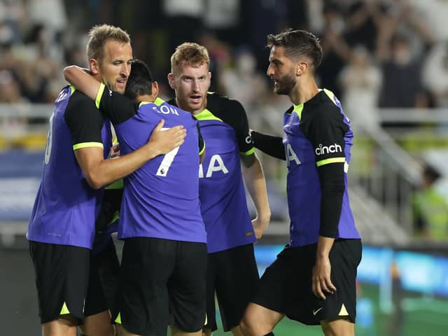  Harry Kane of Tottenham Hotspur celebrates with team mate Son Heung-Min  (Photo by Han Myung-Gu/Getty Images)