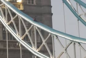 The man on Tower Bridge which forced police to close it.