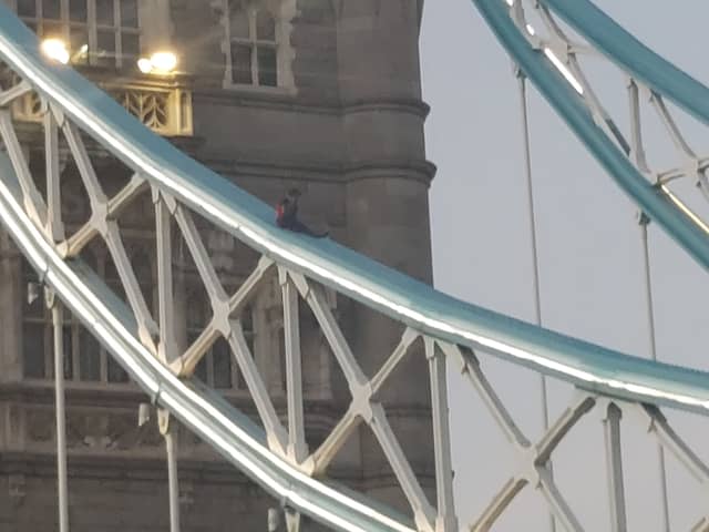The man on Tower Bridge which forced police to close it.