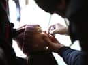 A Syrian child receives a vaccination against polio during a campaign organised by the Syrian Arab Red Crescent