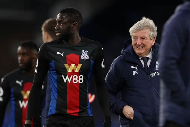 Cheikhou Kouyate of Crystal Palace and Roy Hodgson, Manager of Crystal Palace look on (Photo by Clive Brunskill/Getty Images)