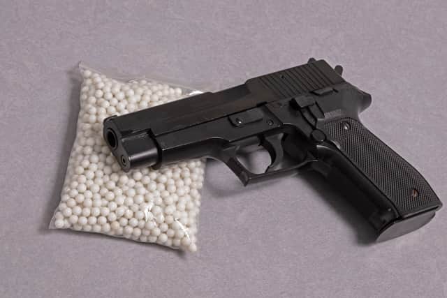 A stock photo of an airsoft BB gun with BB pellets, the kind of firearm which was found at the scene after the Greenwich shooting. Credit: Adobe Stock