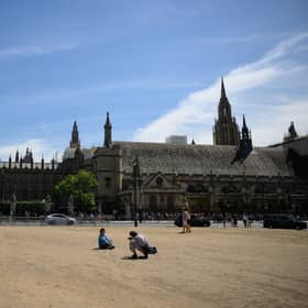 Parliament Square - usually grass covered - has been dust for most of the summer due to the hot weather and drought. Credit: Leon Neal/Getty Images
