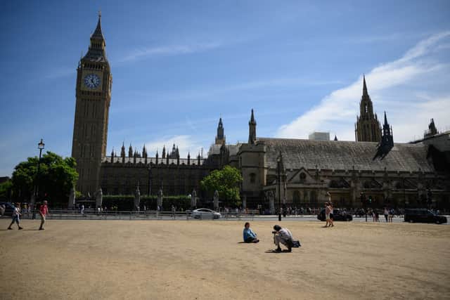 Parliament Square - usually grass covered - has been dust for most of the summer due to the hot weather and drought. Credit: Leon Neal/Getty Images
