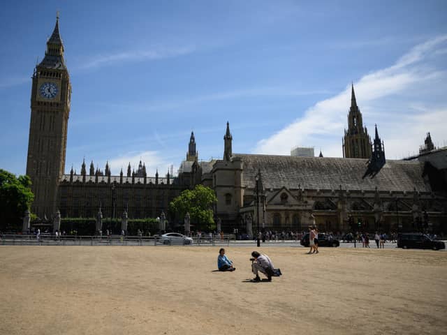 Parliament Square - usually grass covered - has been dust for most of the summer due to the hot weather and drought. Credit: Leon Neal/Getty Images