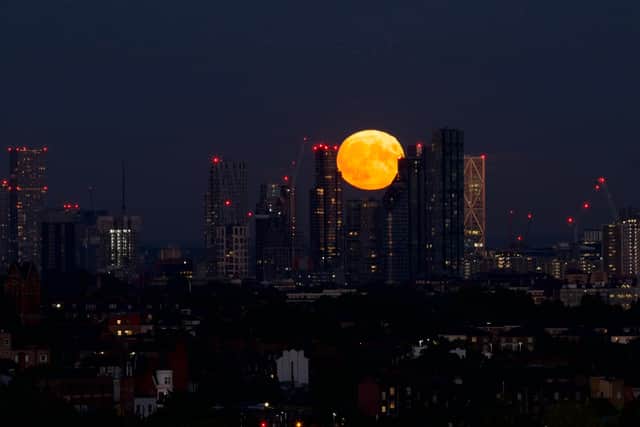Iuli Rukmin captured the supermoon setting behind London’s skyline from Hampstead Heath. Credit: Iuli Rumkin