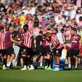 Players of Brentford FC take part in a water break during the Premier League match (Photo by Shaun Botterill/Getty Images)