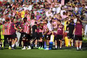 Players of Brentford FC take part in a water break during the Premier League match (Photo by Shaun Botterill/Getty Images)