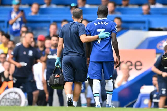 Chelsea’s French midfielder N’Golo Kante (R) leaves the game injured during the English Premier League football match between Chelsea and Tottenham Hotspur at Stamford Bridge. Credit: GLYN KIRK/AFP via Getty Images