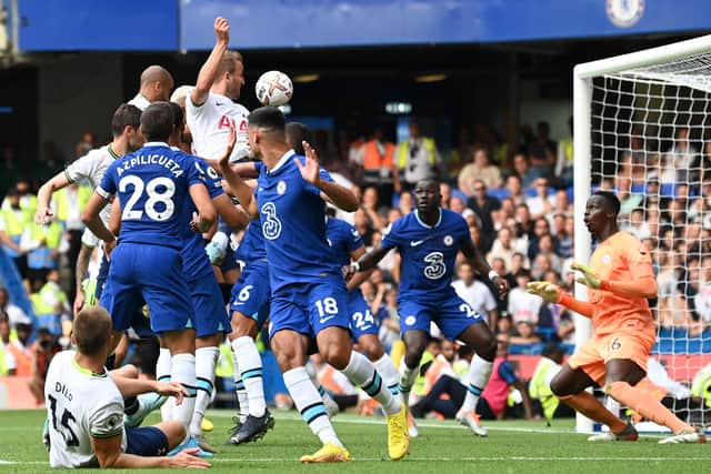 Harry Kane heads home a late second goal as Spurs claimed a point from their visit to Chelsea (Photo by GLYN KIRK/AFP via Getty Images)