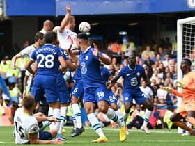 Harry Kane heads home a late second goal as Spurs claimed a point from their visit to Chelsea (Photo by GLYN KIRK/AFP via Getty Images)