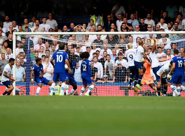 <p>Harry Kane of Tottenham Hotspur scores their sides second goal during the Premier League match between Chelsea and Tottenham Hotspur (Photo by Shaun Botterill/Getty Images)</p>