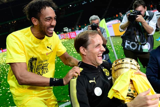 Dortmund’s Gabonese forward Pierre-Emerick Aubameyang (L) and Dortmund’s head coach Thomas Tuchel celebrate  (Photo credit should read TOBIAS SCHWARZ/AFP via Getty Images)
