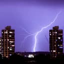 Lightning flashes in the night sky over South London