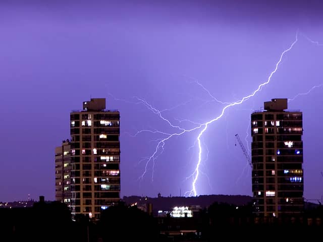 Lightning flashes in the night sky over South London