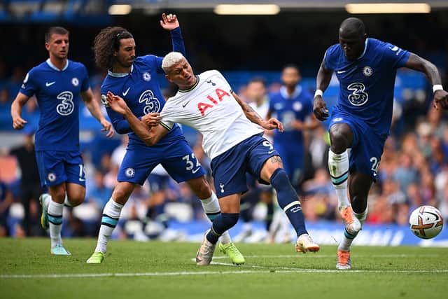 Richarlison of Tottenham Hotspur is challenged by Marc Cucurella and Kalidou Koulibaly of Chelsea (Photo by Clive Mason/Getty Images)