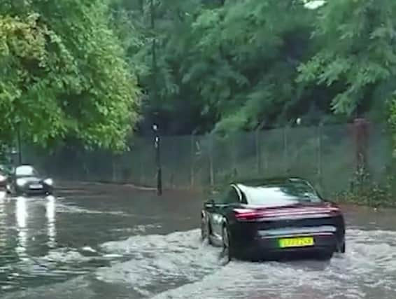 Flash floods struck outside Chiswick Park tube station on Acton Lane. Photo: SWNS