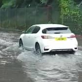Torrential rain that forced commuters to wade through knee-deep water in London. Photo: SWNS