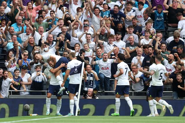 Harry Kane of Tottenham Hotspur celebrates their sides first goal with team mate Ivan Perisic (Photo by Catherine Ivill/Getty Images)