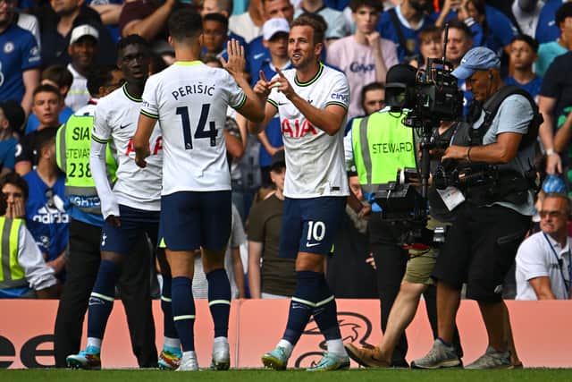 Harry Kane of Tottenham Hotspur celebrates with team mates after scoring their sides second goal (Photo by Clive Mason/Getty Images)