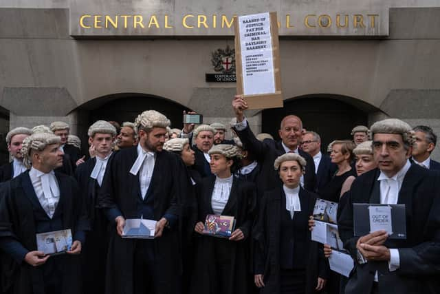 Defence barristers take part in a strike outside the Central Criminal Court, also known as the Old Bailey. Photo: Getty