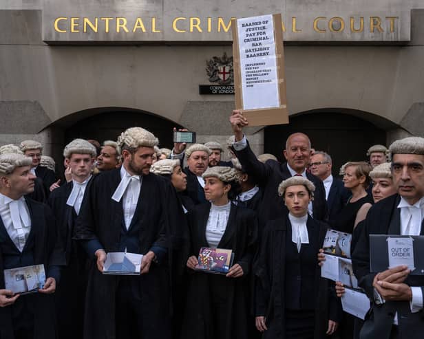 Defence barristers take part in a strike outside the Central Criminal Court, also known as the Old Bailey. Photo: Getty