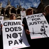 Senior criminal lawyers hold placards outside the Royal Courts of Justice, as they go on strike in a dispute over pay. Photo: Getty