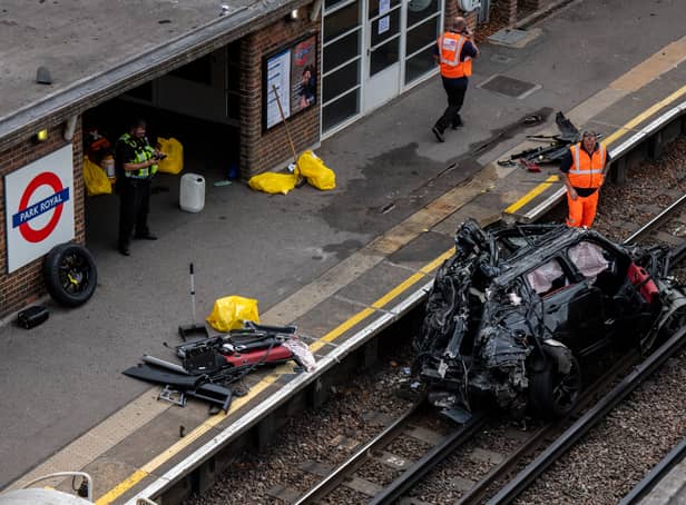 <p>The wreckage of the Range Rover left the road and ended up on the tube tracks. Photo: Getty</p>